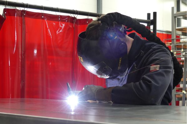 Fe26 Fabrications - Welder working